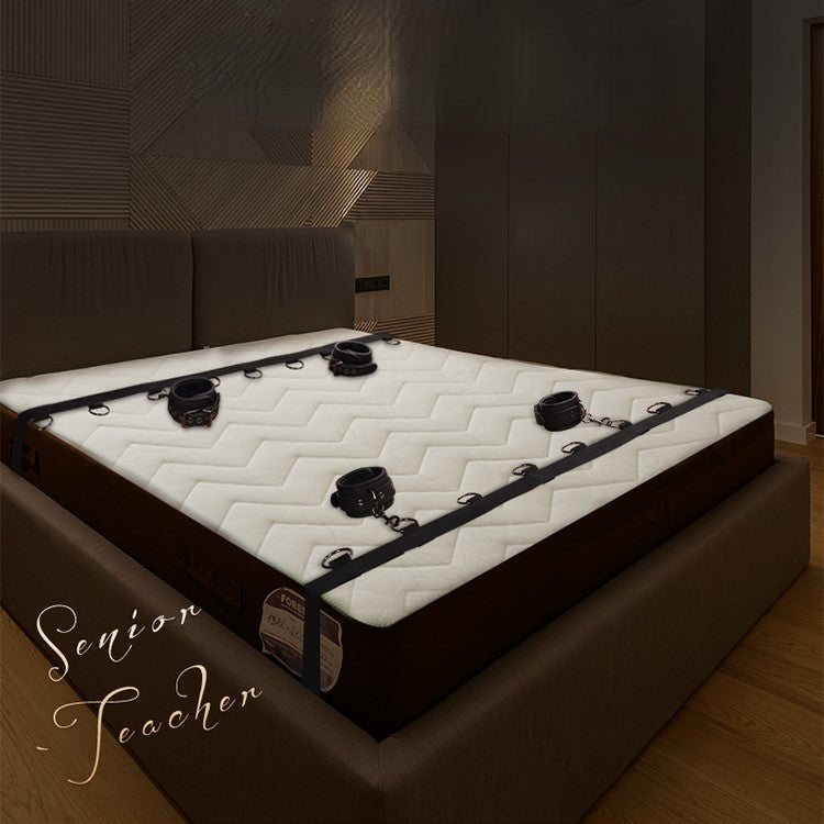 Bed restraints for couples with blindfold and feather accessories