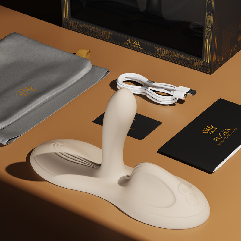 app controlled clit g-spot vibrator ZALO Flora with accessories including charger, storage pouch, and user manual.
